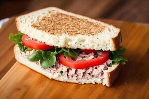 Sandwich with ham, cheese and salad on a white plate. sandwich with tuna and vegetables. photo