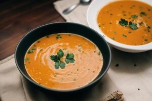 Pumpkin soup with cream and parsley. Creamy tomato soup. Chicken noodle soup. photo