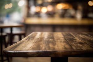 Wooden table in front of abstract blurred coffee shop background. photo