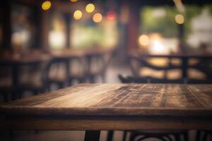 Wooden table in front of abstract blurred coffee shop background. photo