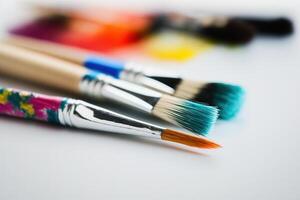 Colorful Paint Brushes with isolated white background and copy space. photo