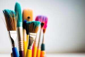 Colorful Paint Brushes with isolated white background and copy space. photo