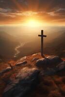 The cross and sun risen over the valley photo