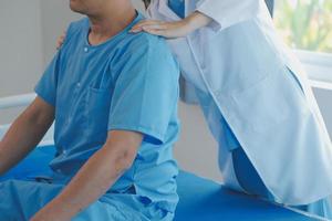 Patient doing some special exercises under supervision in a room photo