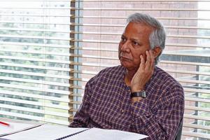 Bangladesh September 20, 2012 Muhammad Yunus, a Bangladeshi social entrepreneur, banker, economist, and civil society leader is listening to the discussion at a conference at Grameen centre, Dhaka. photo