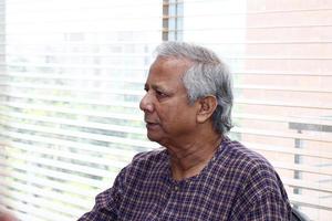 Bangladesh September 20, 2012 Muhammad Yunus, a Bangladeshi social entrepreneur, banker, economist, and civil society leader is listening to the discussion at a conference at Grameen centre, Dhaka. photo