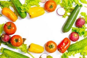 Flat lay composition with fresh ripe vegetables on white background.    Flat lay set of seasonal vegetables on a white background. Frame of various vegetables on a white background photo