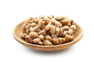 Natto or Fermented Soybean in wood plate isolated on white background. Natto or Fermented Soybean Japanese food isolated photo