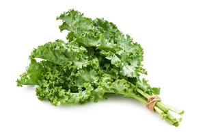 close-up fresh green Kale leaves bunch leaf cabbage isolated on white background. green kale or leaf cabbage isolated photo