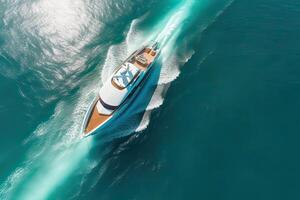 View from above, stunning aerial view of the Cala di volpe bay with a green coastline, white sand beaches and luxury yachts sailing on a turquoise water. photo