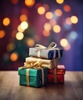 Christmas presents wrapped in colorful paper with ribbon on wooden table background and bokeh. Place for typography and logo. Copy space. . photo