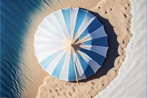 azul y blanco paraguas sentado en parte superior de un arenoso playa. generativo ai. foto