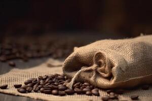 Roasted coffee beans falling in a burlap sack. Sackcloth bag with coffee beans. . photo