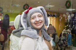 A woman in a bunny costume at the Christmas party. photo