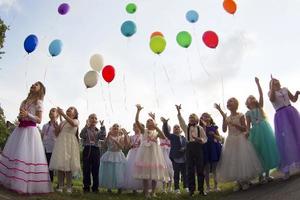 Graduation in kindergarten. Elegant children graduates of a kindergarten with balloons. photo