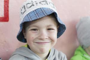 Portrait of a cheerful preschooler boy in panama. photo