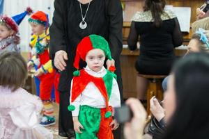 Overweight child in carnival costume on holiday. photo