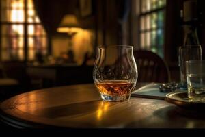Rich whiskey in a glass, poised elegantly on a wooden table. photo