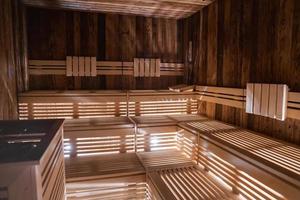 Finnish sauna room with wooden benches in luxury hotel photo