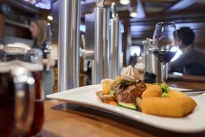 Fresh food served in plate on table at restaurant photo