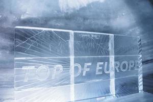 Jungfrau ice palace with top of europe text on frame in glacier tunnel photo