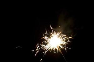 sparklers on a black background photo