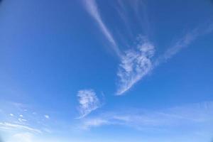 blue sky background with white clouds on a warm summer day photo