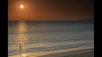 Time lapse video of sunset over sea