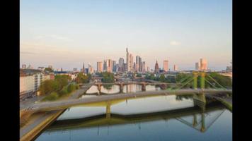 Time-lapse video of drone flight over Main river near Frankfurt towards skyline
