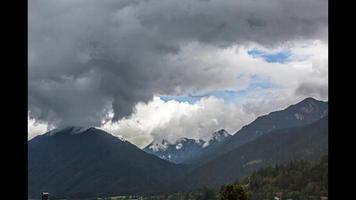 Time-lapse video of a mountain range during a thunderstorm with fast moving clouds