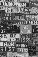 Various old car license plates from around the world at the museum photo