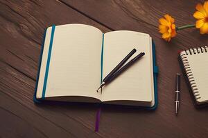 A book with a pen on it and a flower on the table. photo