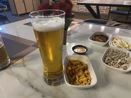 Snacks and beer on the table in a pub. Close up photo