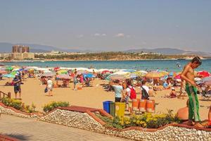 Altinkum beach in Didim, Turkey on a warm summer holiday day photo