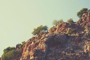 Mediterranean landscape and rocks in the Turkish city of Alanya on a warm summer afternoon photo