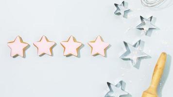 Ginger cookies in the form of stars, covered with pink glaze photo