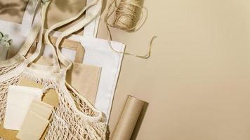 Textile bags, paper bag, mesh bag, wrapping paper and twine with copy space photo