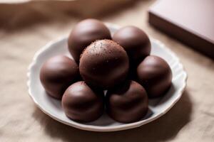 An assortment of chocolate, candy, bars and chocolate pieces on a wooden background, sweet food. Chocolate cake. photo