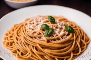 Spaghetti pasta with parmesan cheese and parsley on a plate. photo