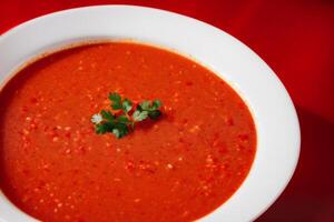 Pumpkin soup with cream and parsley. Creamy tomato soup. Chicken noodle soup. photo