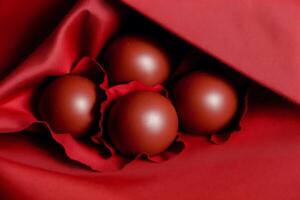 An assortment of chocolate, candy, bars and chocolate pieces on a wooden background, sweet food. Chocolate cake. photo