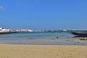 view of the beach and blue ocean on the Canary Island Fuerteventura in Spain photo