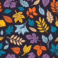 seamless background pattern with autumn leaves silhouettes vector