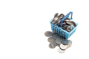 Basket of coins on white background.Finance, business concept, copy space. photo