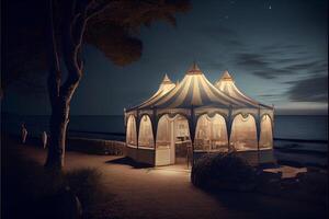 tent sitting on top of a beach next to the ocean. . photo