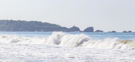 Extremely huge big surfer waves beach La Punta Zicatela Mexico. photo