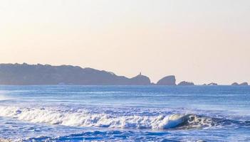 Extremely huge big surfer waves beach La Punta Zicatela Mexico. photo