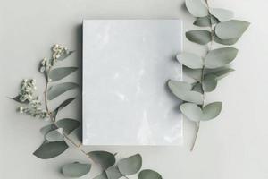 Marble paper blank, eucalyptus branches on pastel gray background, generate ai photo