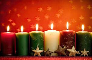 Burning candle and Christmas decoration over snow and wooden background. . photo