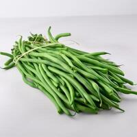 A composition of a slender green beans on white background photo